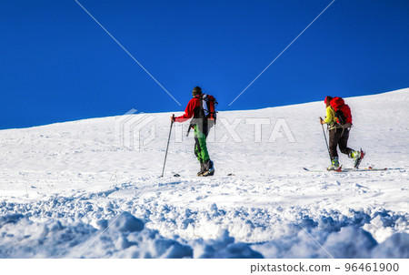 Cross-country skiing on snowy hillside. Winter season sport activities 96461900