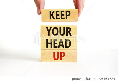 Keep your head up symbol. Concept words Keep your head up on wooden cubes. Beautiful white table white background. Businessman hand. Business motivational keep your head up concept. Copy space. 96463724