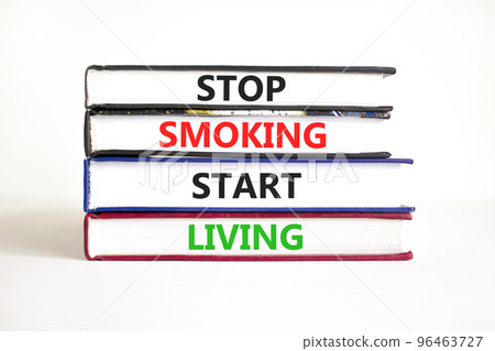 Stop smoking start living symbol. Concept words Stop smoking start living on books. Beautiful white table white background. Medical healthy lifestyle stop smoking start living concept. Copy space. Stop smoking start living symbol. Concept words Stop smoking start living on books. Beautiful white table white background. Medical healthy lifestyle stop smoking start living concept. Copy space. 96463727