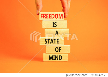 Freedom in mind symbol. Concept words Freedom is a state of mind on wooden blocks on a beautiful orange table orange background. Businessman hand. Business freedom is a state of mind concept. Freedom in mind symbol. Concept words Freedom is a state of mind on wooden blocks on a beautiful orange table orange background. Businessman hand. Business freedom is a state of mind concept. 96463747