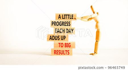 Progress and result symbol. Concept words A little progress each day adds up to big results on wooden blocks on a beautiful white background. Businessman icon. Business future in your hands concept. Progress and result symbol. Concept words A little progress each day adds up to big results on wooden blocks on a beautiful white background. Businessman icon. Business future in your hands concept. 96463749