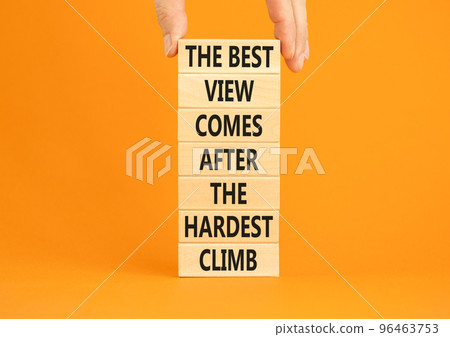 Best view after the hardest climb symbol. Concept words The best view comes after the hardest climb on blocks on a beautiful orange background. Businessman hand. Business success concept. Copy space Best view after the hardest climb symbol. Concept words The best view comes after the hardest climb on blocks on a beautiful orange background. Businessman hand. Business success concept. Copy space 96463753