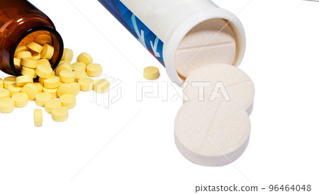 Pills in transparent pill bottle. 96464048