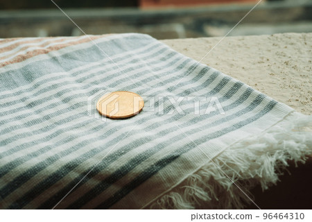 Bitcoin Coin Lies On Beach Towel On Background Of Hotel Swimming Pool In Moraitika, Corfu, Greece. The Concept Of Payment For Relax And Unlimited Possibilities. Bitcoin Coin Lies On Beach Towel On Background Of Hotel Swimming Pool In Moraitika, Corfu, Greece. The Concept Of Payment For Relax And Unlimited Possibilities. 96464310