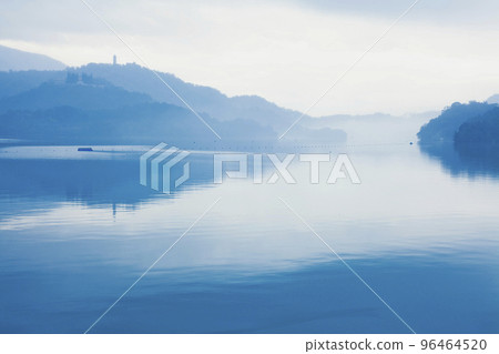 The morning mist scenery of Sun Moon Lake is a famous attraction in Nantou, Taiwan. 96464520