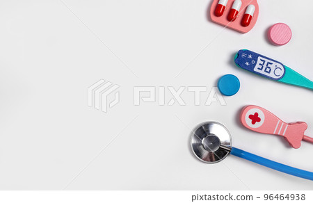 Banner with medical tools. Health care, medicine concept. Stethoscope, thermometer, pills. Doctor instruments kit for children. Copy space. 96464938