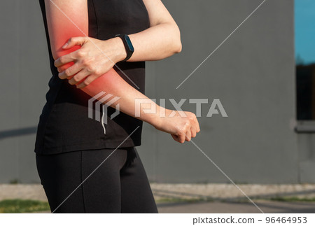 Elbow pain, sport trauma of woman athlete 96464953