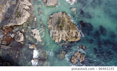 A lot of boulders in the sea. Coastal cliffs of the North Atlantic. Seaside beautiful nature. Dramatic seascape of the north of Europe. A lot of boulders in the sea. Coastal cliffs of the North Atlantic. Seaside beautiful nature. Dramatic seascape of the north of Europe. 96465235