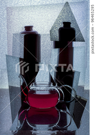 Abstract collage with a glass teapot with red liquid 96465295