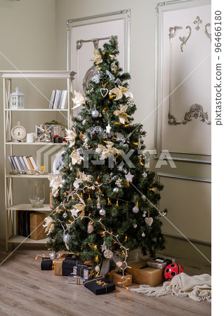 Christmas tree with presents underneath in living room 96466180