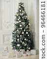Christmas tree with presents underneath in living room 96466181