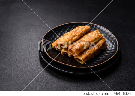 Fresh bite rolls from leaves of cabbage with minced meat, onions and carrots 96466385