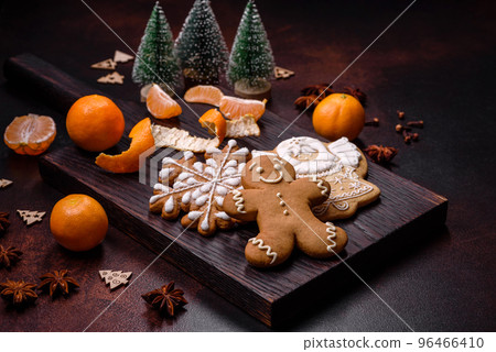 Beautiful Christmas decorations with holiday toys, clementines and gingerbread Beautiful Christmas decorations with holiday toys, clementines and gingerbread 96466410