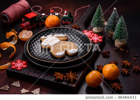 Beautiful Christmas decorations with holiday toys, clementines and gingerbread Beautiful Christmas decorations with holiday toys, clementines and gingerbread 96466431