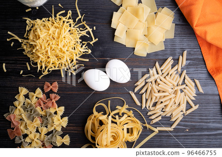 recipe of  of italian pasta on dark wooden table. dry pasta background 96466755