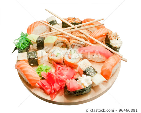 sushi set and chopsticks on the wooden desk isolated on white sushi set and chopsticks on the wooden desk isolated on white 96466881