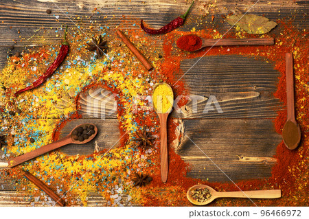 Set of spices on wooden background. Food art concept. Set of spices on wooden background. Food art concept. 96466972