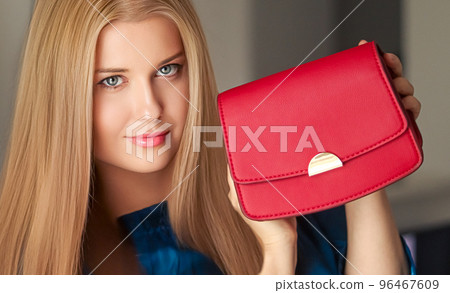 Fashion and accessories, happy beautiful woman holding small red handbag with golden details as stylish accessory and luxury shopping concept Fashion and accessories, happy beautiful woman holding small red handbag with golden details as stylish accessory and luxury shopping concept 96467609