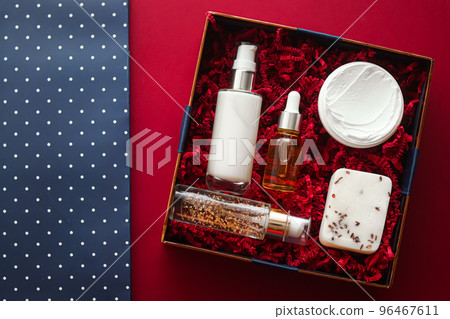 Beauty box subscription package and luxury skincare products, spa and cosmetic body care product flat lay on red background, wellness cosmetics as holiday gift, online shopping delivery, flatlay view 96467611