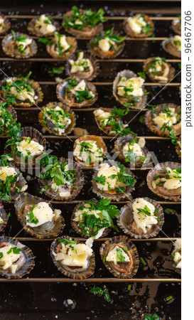 Limpets molluscs with garlic parsley butter Limpets molluscs with garlic parsley butter 96467706
