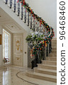 Christmas decorations in the hall of luxurious home with marble stairs and floor 96468460