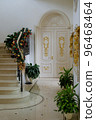 Christmas decorations in the hall of luxurious home with marble stairs and floor 96468464