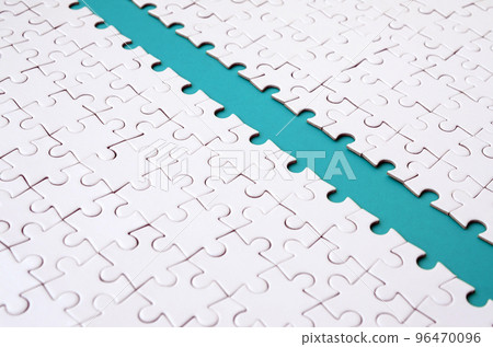 The blue path is laid on the platform of a white folded jigsaw puzzle. Texture image with copy space for text The blue path is laid on the platform of a white folded jigsaw puzzle. Texture image with copy space for text 96470096