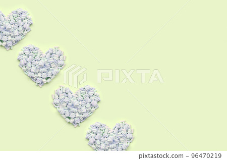Colorful marshmallow laid out on lime and pink paper background. pastel creative textured hearts 96470219