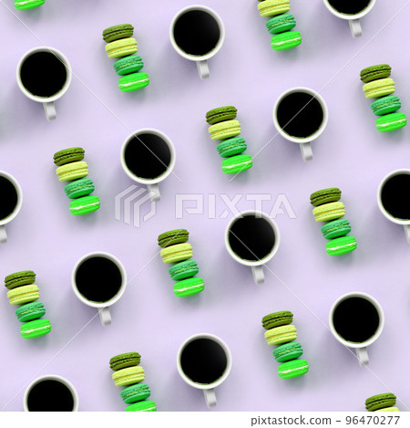 A pattern of many colorful dessert cake macaroon and coffee cups on trendy pastel lilac background top view A pattern of many colorful dessert cake macaroon and coffee cups on trendy pastel lilac background top view 96470277