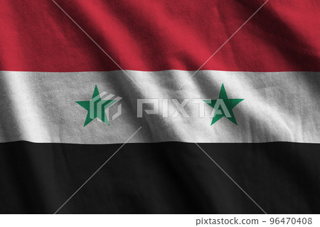 Syria flag with big folds waving close up under the studio light indoors. The official symbols and colors in banner Syria flag with big folds waving close up under the studio light indoors. The official symbols and colors in banner 96470408