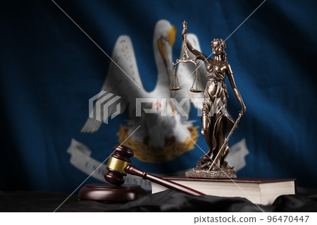 Louisiana US state flag with statue of lady justice, constitution and judge hammer on black drapery. Concept of judgement and guilt 96470447
