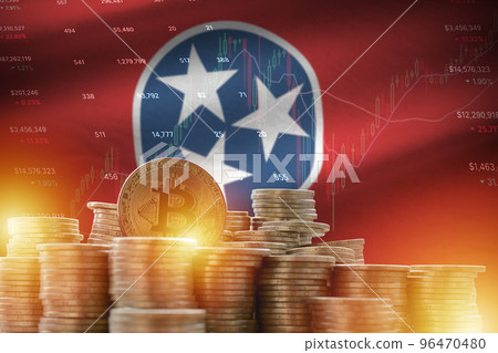 Tennessee US state flag and big amount of golden bitcoin coins and trading platform chart. Crypto currency 96470480