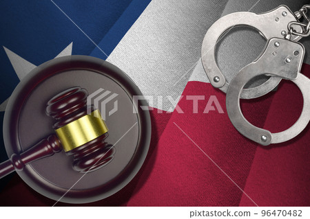 Texas US state flag with judge mallet and handcuffs in dark room. Concept of criminal and punishment 96470482