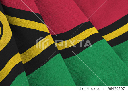 Vanuatu flag with big folds waving close up under the studio light indoors. The official symbols and colors in banner Vanuatu flag with big folds waving close up under the studio light indoors. The official symbols and colors in banner 96470507