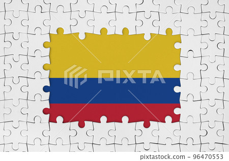 Colombia flag in frame of white puzzle pieces with missing central part 96470553