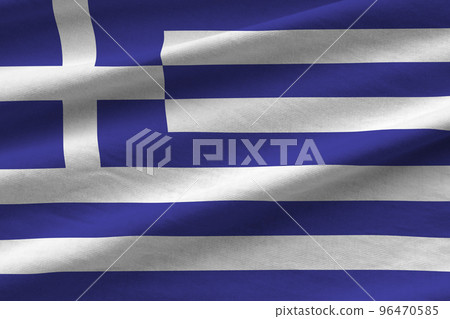 Greece flag with big folds waving close up under the studio light indoors. The official symbols and colors in banner 96470585