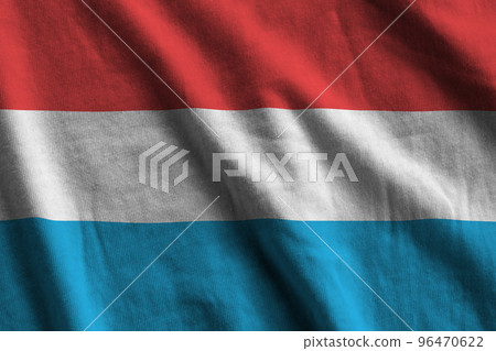 Luxembourg flag with big folds waving close up under the studio light indoors. The official symbols and colors in banner Luxembourg flag with big folds waving close up under the studio light indoors. The official symbols and colors in banner 96470622