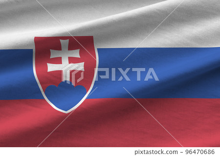 Slovakia flag with big folds waving close up under the studio light indoors. The official symbols and colors in banner 96470686