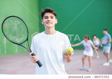Portrait of caucasian man frontenis player in outdoor court 96472302