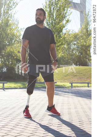Portrait of serious man with disability starting to train 96472872