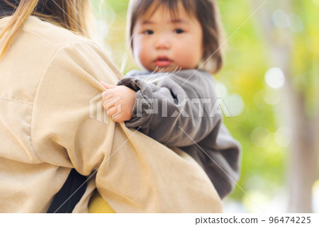 Parents and children playing in the autumn park 96474225