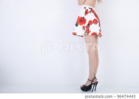 Sexy feet of a woman wearing a miniskirt 96474443