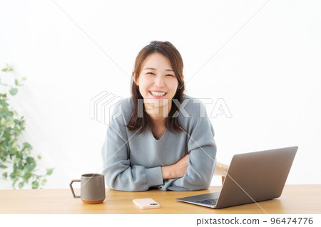 Woman doing work at home Woman doing work at home 96474776