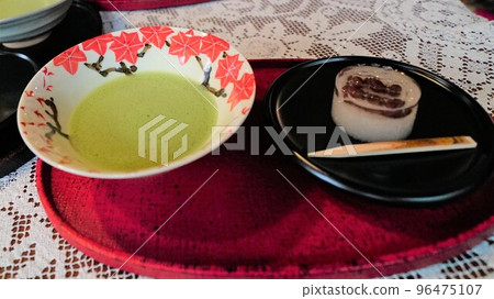Japanese culture, matcha green tea and Japanese sweets. The inside of the vessel is autumn leaves, green and vermilion. 96475107