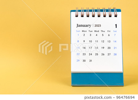 The April 2023 desk calendar on yellow color background. The April 2023 desk calendar on yellow color background. 96476694