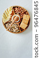 Wooden round menagerie in women's hands 96476845