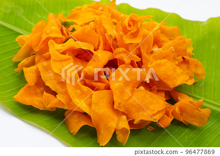 Sweet potato chips on white background. 96477869