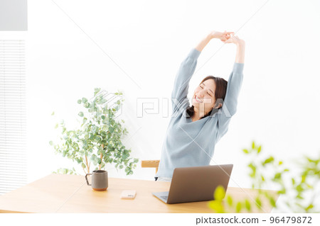 Woman doing work at home Woman doing work at home 96479872