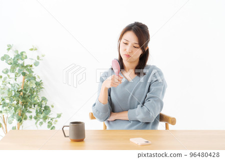 Woman suffering from hair care 96480428
