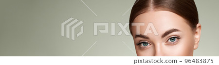 Female eye with long false eyelashes Female eye with long false eyelashes 96483875
